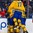 BUFFALO, NEW YORK - JANUARY 4: Sweden's Fredrik Karlstrom #17 joins Gustav Lindstrom #5 and Alexander Nylander #19 in celebrating a third period goal by Lias Andersson #24 (hidden from view) against USA during the semi-final round of the 2018 IIHF World Junior Championship. (Photo by Andrea Cardin/HHOF-IIHF Images)


